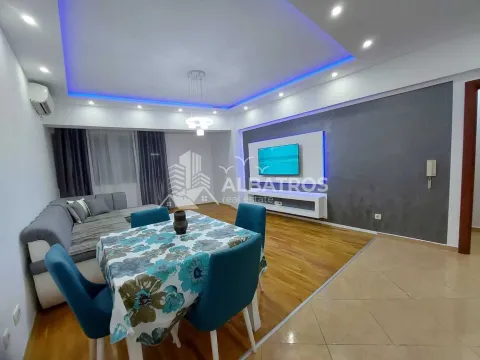 Living room with a dining area and modern ceiling lighting. - image 5