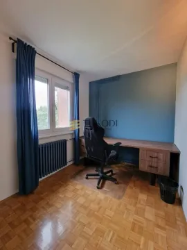 Study room with a desk and an office chair. - image 12