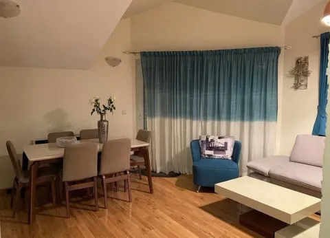 Living room with a dining area and seating set. - image 3