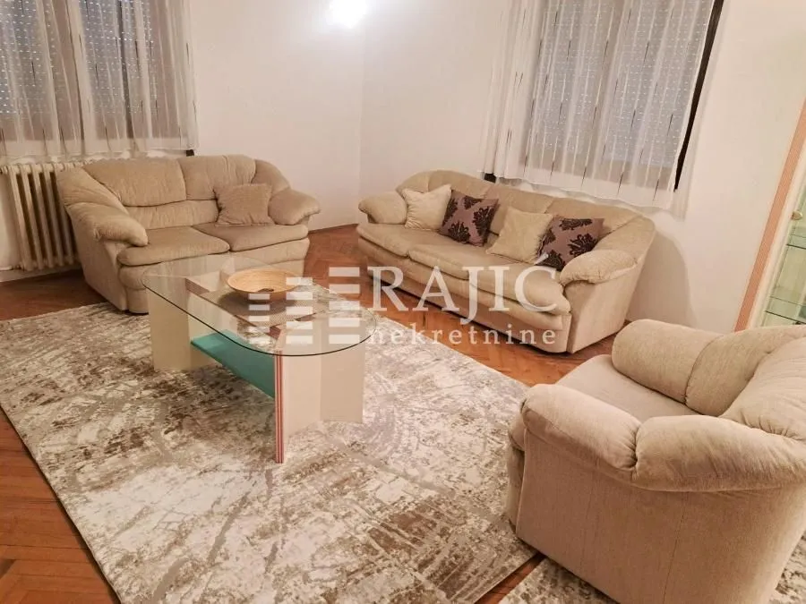 Living room with a seating set and a coffee table.