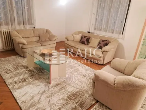 Living room with a seating set and a coffee table. - image 2