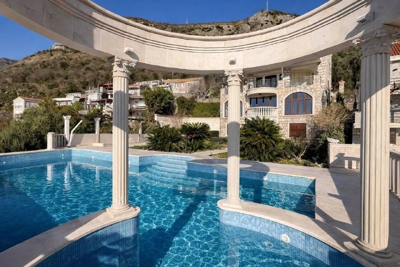 Swimming pool with columns in the villa yard.
