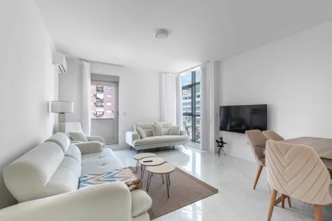 Bright and spacious living room with sofa set and dining area. - image 3
