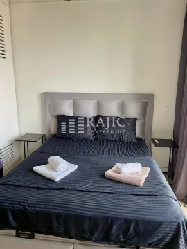 Furnished bedroom with a double bed. - image 18