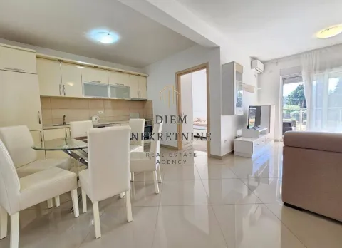 Living room with dining area and kitchen in light tones. - image 6