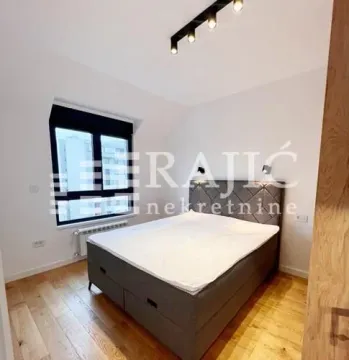 Furnished bedroom with a double bed. - image 7