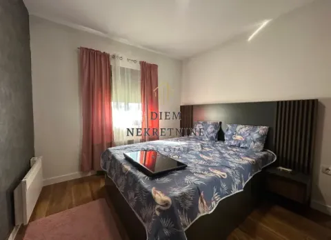 Furnished bedroom with a double bed. - image 9