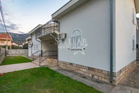 Exterior view of the house with a yard and a balcony. - image 2