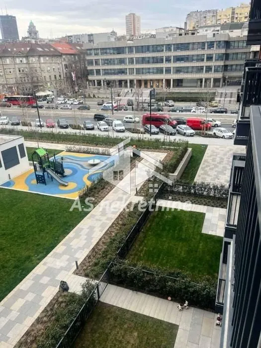 View from the terrace overlooking the city street and park.