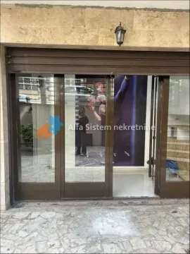Entrance to the commercial space with glass doors and storefront. - image 12