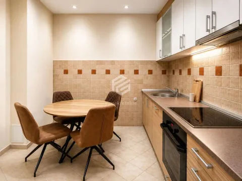 Kitchen with a dining table and chairs. - image 4