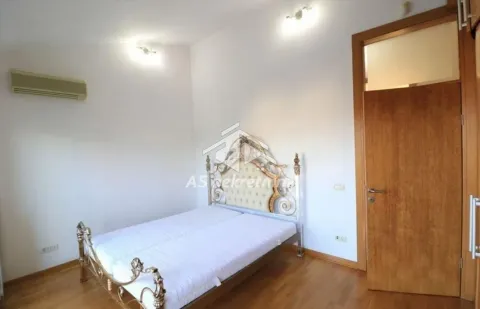 Bedroom with a double bed and wooden flooring. - image 14