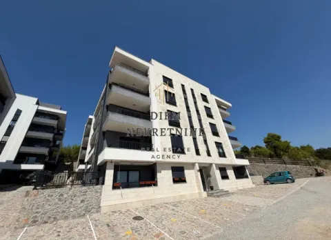 Exterior of a modern residential building with parking and a landscaped yard. - image 15