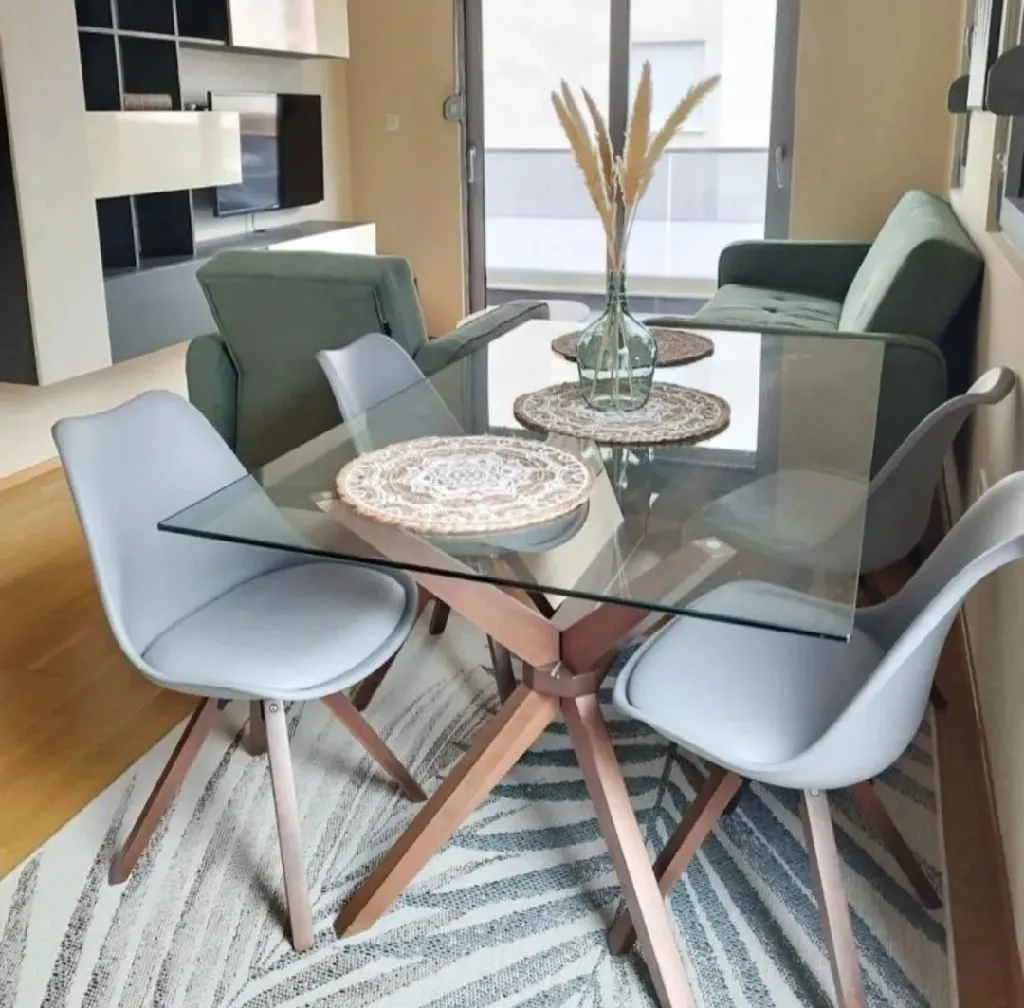 Furnished living room with a dining table and chairs.