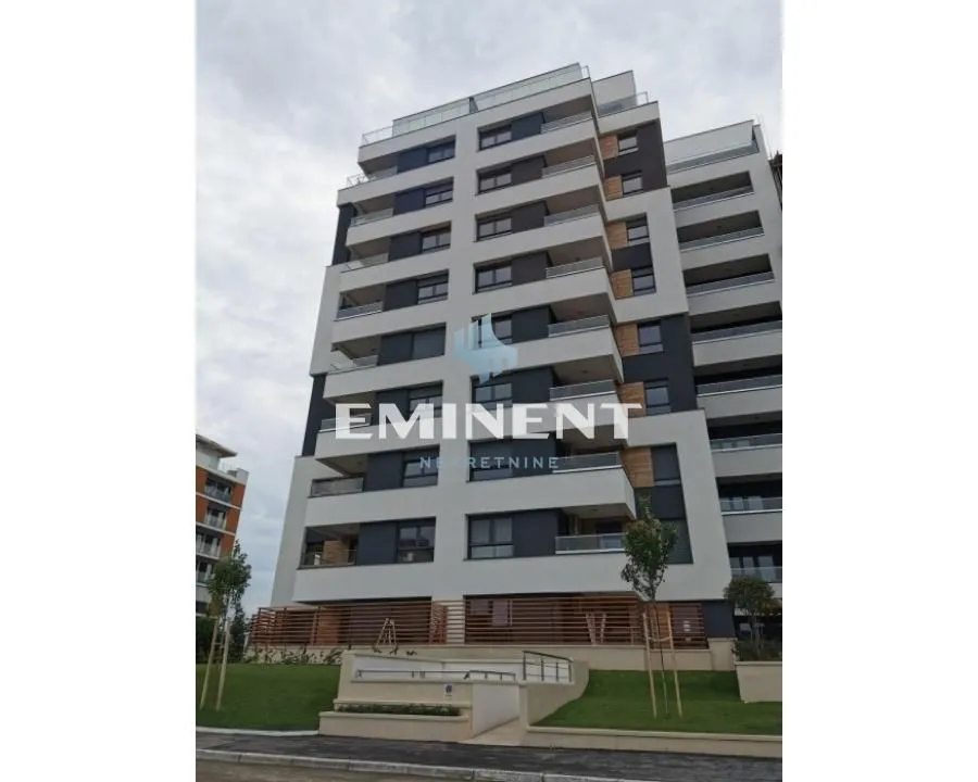 Exterior view of a modern residential building with balconies.