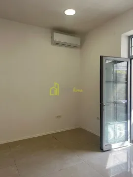 Empty room with an air conditioner and a door leading to the terrace. - image 6