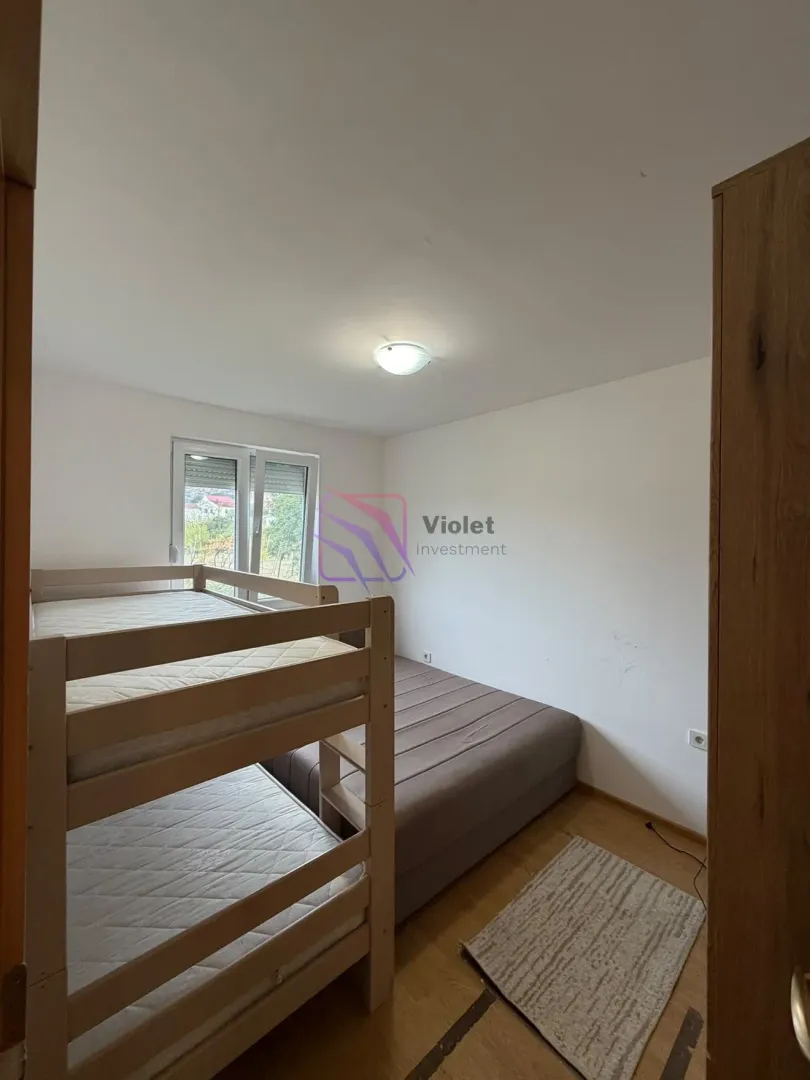 Bedroom with a bunk bed and a double bed.