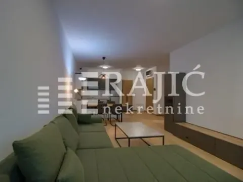 Living room with a sofa set connected to the dining area and kitchen. - image 4