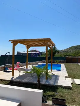 Yard with a swimming pool, wooden gazebo and relaxation area. - image 18