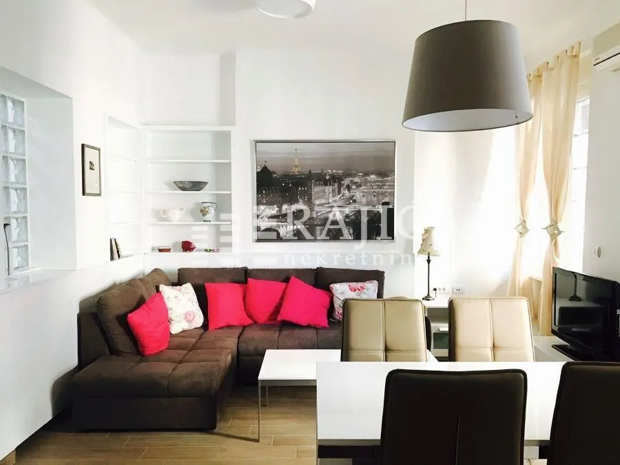 Living room with sofa set and dining table.