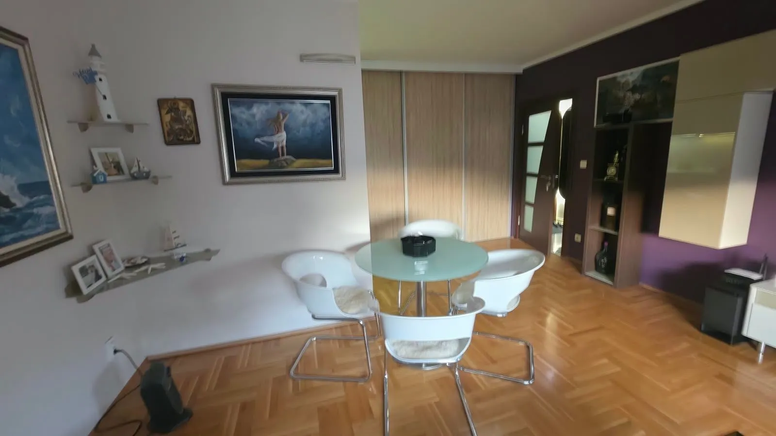 Living room with a dining table and chairs.