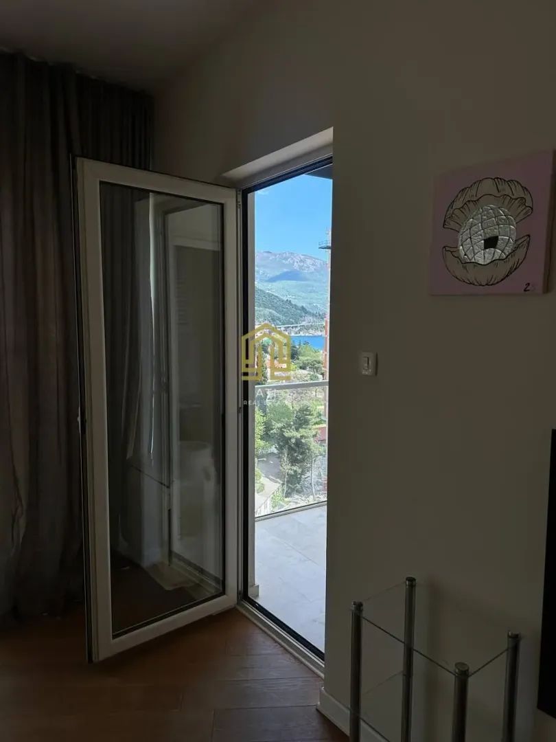 View from the living room onto the terrace and surrounding area.