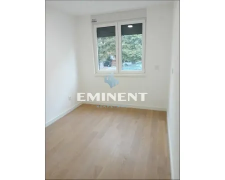 Empty bright room with a window and wooden flooring. - image 6