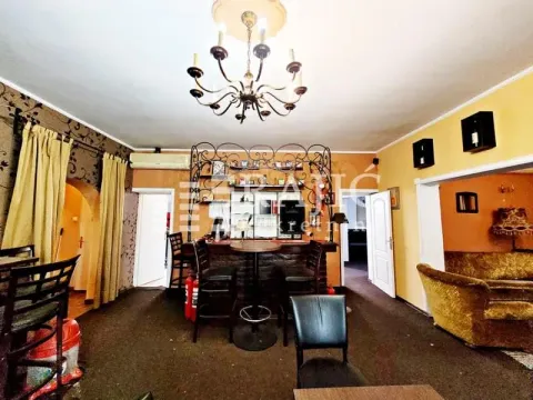 Living room with a bar and dining area. - image 5