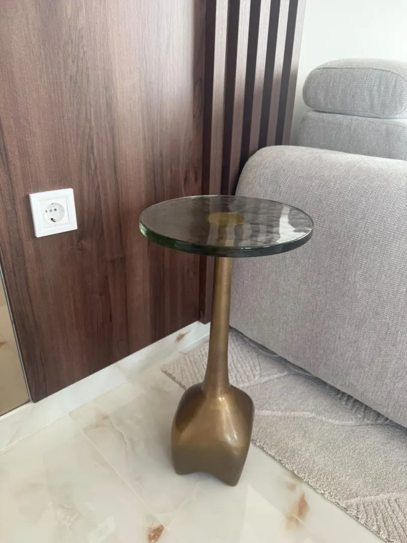 Interior detail featuring a side table and sofa in the living room.