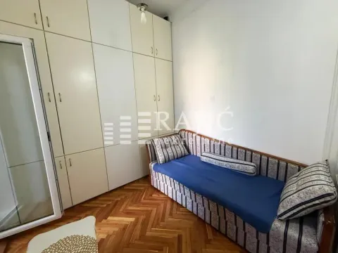 Smaller bedroom with a bed and a built-in wardrobe. - image 5
