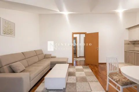 Dnevna soba sa garniturom, stočićem i trpezarijskim delom u nastavku. - image 8