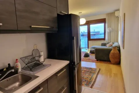View from the kitchen towards the living room and terrace. - image 10
