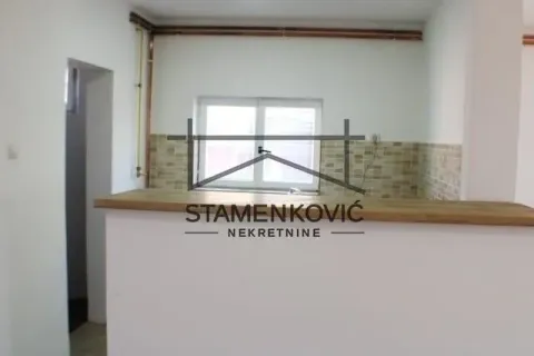 Empty kitchen with a window and a breakfast bar in an unfurnished condition. - image 14