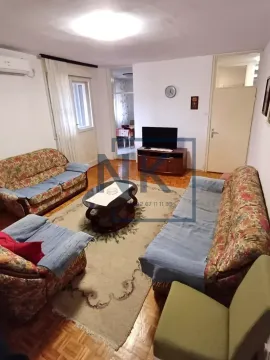 Living room with sofa set, coffee table, and TV. - image 2