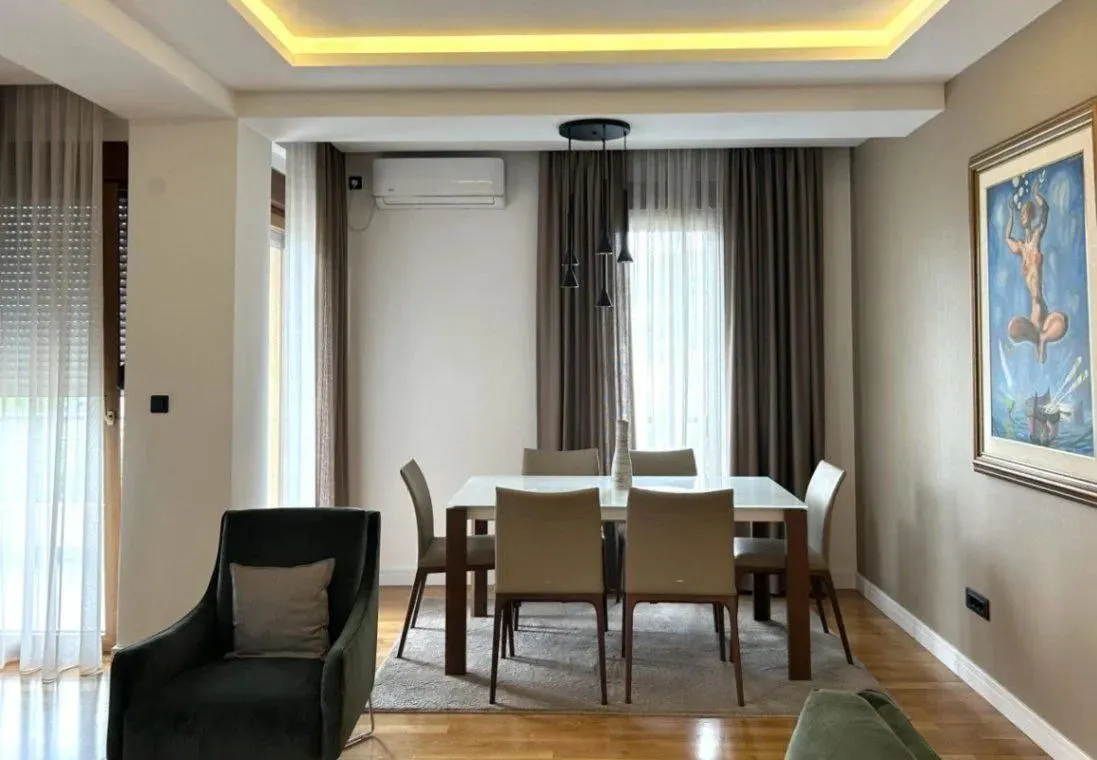 Living room with a dining table and chairs.