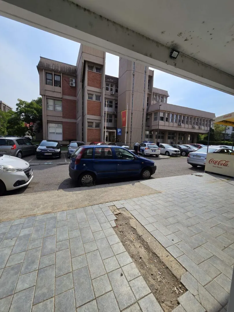 View of the building exterior and the parking lot in front.