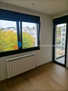 Empty room with parquet flooring, large windows, and access to the terrace. - image 6