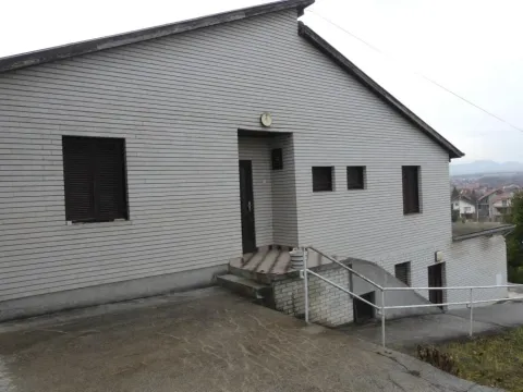 View of the exterior of the house with siding and entrance door. - image 4