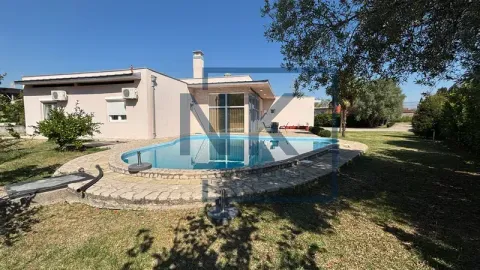 View of the house yard with a swimming pool and landscaped lawn. - image 2