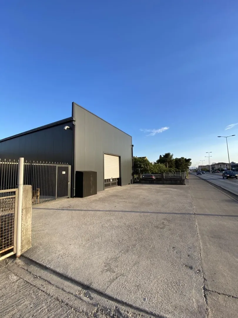 Modern commercial building next to the road.