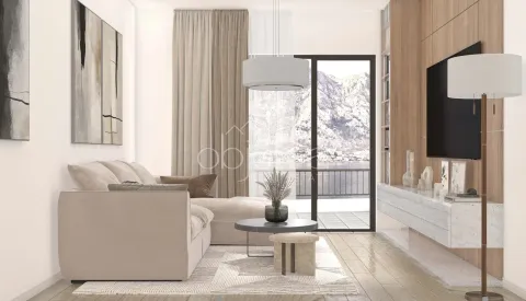 Modern living room with a sofa, TV, and a view of the sea through the balcony doors. - image 8