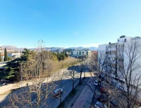 View from the terrace overlooking the city neighborhood and surrounding mountains. - image 8