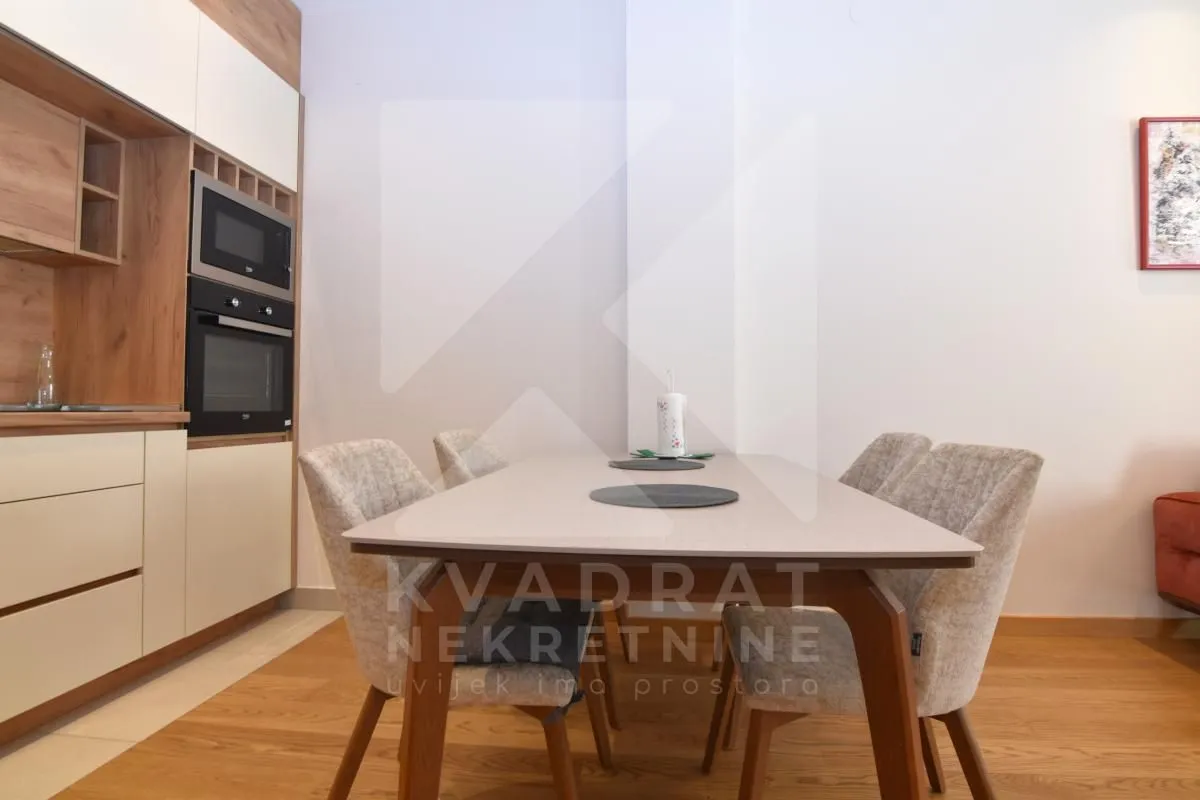 Kitchen with a dining table and chairs.