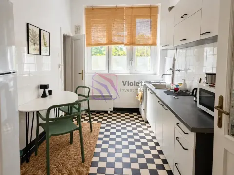 Kitchen with a dining table and a black and white checkerboard floor. - image 4