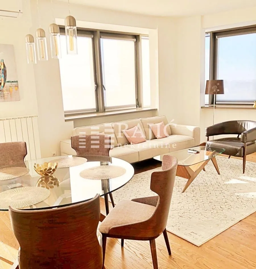 Bright living room with dining area and modern furniture.