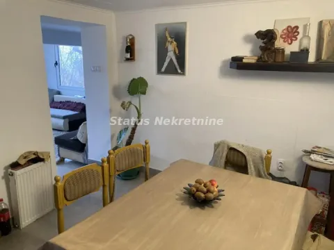 Dining table with chairs in the living room with a view of the adjacent room. - image 14