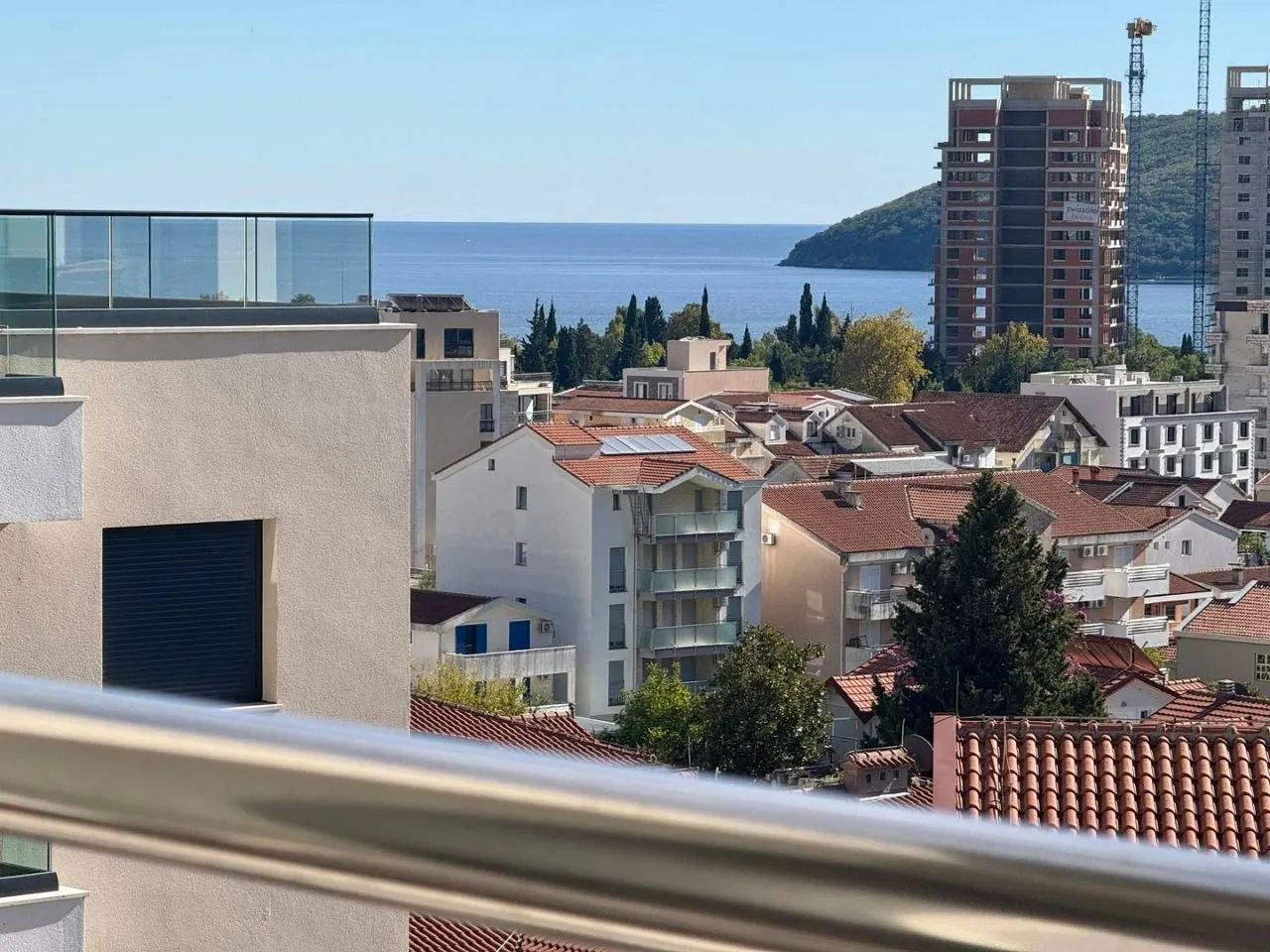 View of the sea and surrounding buildings from the terrace.