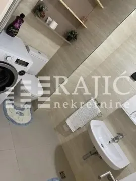 Small bathroom with sanitary fixtures and a washing machine. - image 15