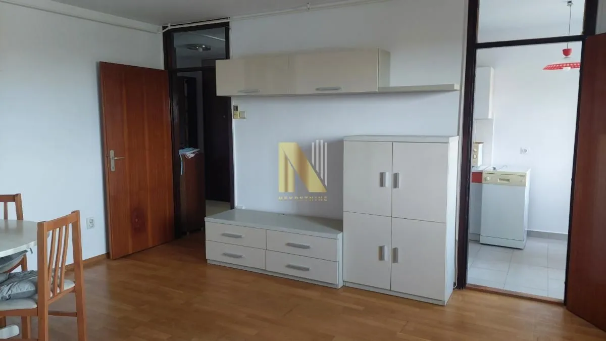 Living room with dining area and access to the kitchen.