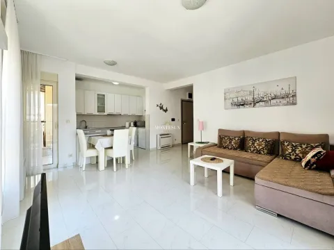 Spacious living room with dining area and open-plan kitchen. - image 3